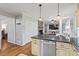 Kitchen view featuring a stone fireplace and a granite countertop at 2410 Overbrook Ln, Sanford, NC 27330