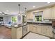 Open kitchen with granite countertops, pendant lighting, stainless steel appliances, and hardwood floors at 2410 Overbrook Ln, Sanford, NC 27330