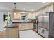 Well-lit kitchen with stainless steel appliances, granite countertops, and traditional cabinetry at 2410 Overbrook Ln, Sanford, NC 27330