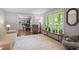 Bright living room with hardwood floors and a large window providing natural light at 2410 Overbrook Ln, Sanford, NC 27330