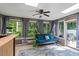 Bright sunroom with skylights, a ceiling fan, large windows, and comfortable seating at 2410 Overbrook Ln, Sanford, NC 27330