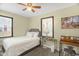 A cozy bedroom with a single bed, natural lighting, and artwork at 2508 Albany St, Durham, NC 27705