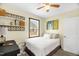 A cozy bedroom with an artistic wall decoration, and a dark wooden bedframe at 2508 Albany St, Durham, NC 27705
