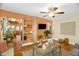 A view of the living room with a decorative brick shelf, an earth-toned accent wall, and hardwood floors at 2508 Albany St, Durham, NC 27705