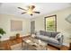 A spacious living room with a gray sofa, natural lighting, and decorative elements at 2508 Albany St, Durham, NC 27705