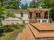 Multi-level wooden deck provides ample space for outdoor gatherings and enjoying backyard views at 280 Sagamore Dr, Louisburg, NC 27549