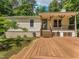 Spacious wooden deck with multiple levels, perfect for outdoor entertaining and relaxation at 280 Sagamore Dr, Louisburg, NC 27549