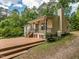 Spacious deck is perfect for outdoor activities in the private, wooded backyard at 280 Sagamore Dr, Louisburg, NC 27549