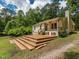 Expansive wooden deck with multiple tiers, ideal for enjoying the peaceful and private backyard at 280 Sagamore Dr, Louisburg, NC 27549