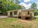 Image of the backyard with the deck and fenced yard, ideal for relaxation or entertaining at 280 Sagamore Dr, Louisburg, NC 27549
