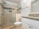 Updated bathroom featuring a glass door shower and marble countertop sink at 280 Sagamore Dr, Louisburg, NC 27549