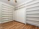 Bedroom features hardwood floors and a built-in murphy bed with shelving at 280 Sagamore Dr, Louisburg, NC 27549