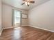 Empty bedroom features hardwood floors, a ceiling fan, and natural light at 280 Sagamore Dr, Louisburg, NC 27549