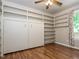 Bedroom features hardwood floors and a built-in murphy bed with shelving at 280 Sagamore Dr, Louisburg, NC 27549