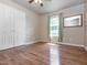 Clean, empty bedroom features hardwood floors, a ceiling fan, and a closet at 280 Sagamore Dr, Louisburg, NC 27549