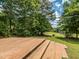 Picture of the tiered wooden deck and stairs with views of the grassy yard at 280 Sagamore Dr, Louisburg, NC 27549