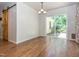 An airy dining area with hardwood floors, barn door accent, and sliding glass doors to the backyard at 280 Sagamore Dr, Louisburg, NC 27549