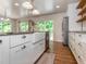 Charming kitchen featuring a farmhouse sink, granite countertops, stainless steel appliances and backyard access at 280 Sagamore Dr, Louisburg, NC 27549