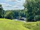Scenic view of the lake with boats docked, surrounded by lush trees and greenery at 280 Sagamore Dr, Louisburg, NC 27549