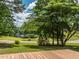 The backyard deck showcases an inviting outdoor space with calming views of the lake at 280 Sagamore Dr, Louisburg, NC 27549