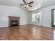 Bright living room with hardwood floors, brick fireplace and big windows and sliding door at 280 Sagamore Dr, Louisburg, NC 27549