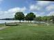 Scenic mini golf course with lake view and green grass; perfect for outdoor fun and relaxation at 280 Sagamore Dr, Louisburg, NC 27549