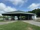 Community pavilion by the water, featuring picnic tables, green roof and open design at 280 Sagamore Dr, Louisburg, NC 27549