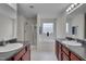 Bright bathroom with dual vanities, a soaking tub, and a separate shower at 3019 Britmass Dr, Raleigh, NC 27616