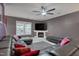 Cozy living room showcasing a fireplace, a large sectional sofa, and modern decor for a comfortable atmosphere at 3019 Britmass Dr, Raleigh, NC 27616