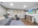 Finished basement featuring daybed, chair, storage, and a TV for flexible living and entertainment space at 309 Old Mill Village Dr, Apex, NC 27502