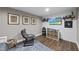 Finished basement with TV, storage, decor, and accent chair, perfect for entertainment and relaxation at 309 Old Mill Village Dr, Apex, NC 27502