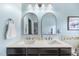 The bathroom features double sinks, white marble counters, and updated lighting at 309 Old Mill Village Dr, Apex, NC 27502