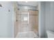 The bathroom features a glass enclosed shower, a built-in seat, and tile surround at 309 Old Mill Village Dr, Apex, NC 27502