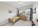 This bedroom has natural light, carpet floors, a light wood bed and dresser at 309 Old Mill Village Dr, Apex, NC 27502