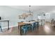 Charming dining area featuring a rustic wood table, designer lighting, and decor at 309 Old Mill Village Dr, Apex, NC 27502