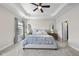This spacious bedroom features a tray ceiling, plush carpet, and elegant furnishings at 309 Old Mill Village Dr, Apex, NC 27502