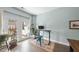 Office area with natural light, workspace, access to a small deck with white furniture at 309 Old Mill Village Dr, Apex, NC 27502