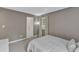 Comfortable bedroom featuring neutral-toned walls and an ensuite bathroom at 309 Penn Oak Cir, Raleigh, NC 27615