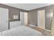 Bedroom showcasing neutral walls, carpet flooring, and a closet at 309 Penn Oak Cir, Raleigh, NC 27615
