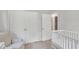 Bright Bedroom features a crib and comfortable chair with closet view at 309 Penn Oak Cir, Raleigh, NC 27615