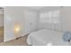 Bright bedroom features a bed, large window, and closet at 309 Penn Oak Cir, Raleigh, NC 27615