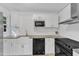 Updated kitchen with stainless steel appliances, white cabinets, and subway tile backsplash at 309 Penn Oak Cir, Raleigh, NC 27615
