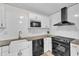 Well-equipped kitchen showcasing modern appliances, granite counters, and white cabinetry at 309 Penn Oak Cir, Raleigh, NC 27615