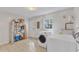 Spacious laundry room with washer, dryer, storage, and backyard access at 309 Penn Oak Cir, Raleigh, NC 27615