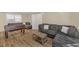 Spacious living room featuring hardwood floors, comfortable seating, and an entertainment area at 309 Penn Oak Cir, Raleigh, NC 27615