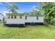 Well-maintained backyard with lush greenery, providing a serene and private outdoor space at 313 W Church St, Angier, NC 27501