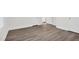 Spacious room with vinyl floors, neutral walls, and two doors at 313 W Church St, Angier, NC 27501
