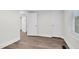 Bedroom featuring vinyl floors, white trim, and a window at 313 W Church St, Angier, NC 27501