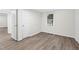 Cozy bedroom featuring luxury vinyl floors, neutral paint and a window at 313 W Church St, Angier, NC 27501