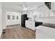 Charming kitchen with white cabinets, modern appliances, and a ceiling fan, offering both style and functionality at 313 W Church St, Angier, NC 27501